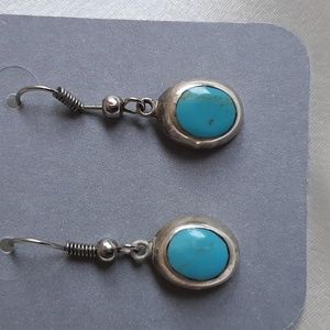 Turquois drop earrings in silver setting. Pierced ears.